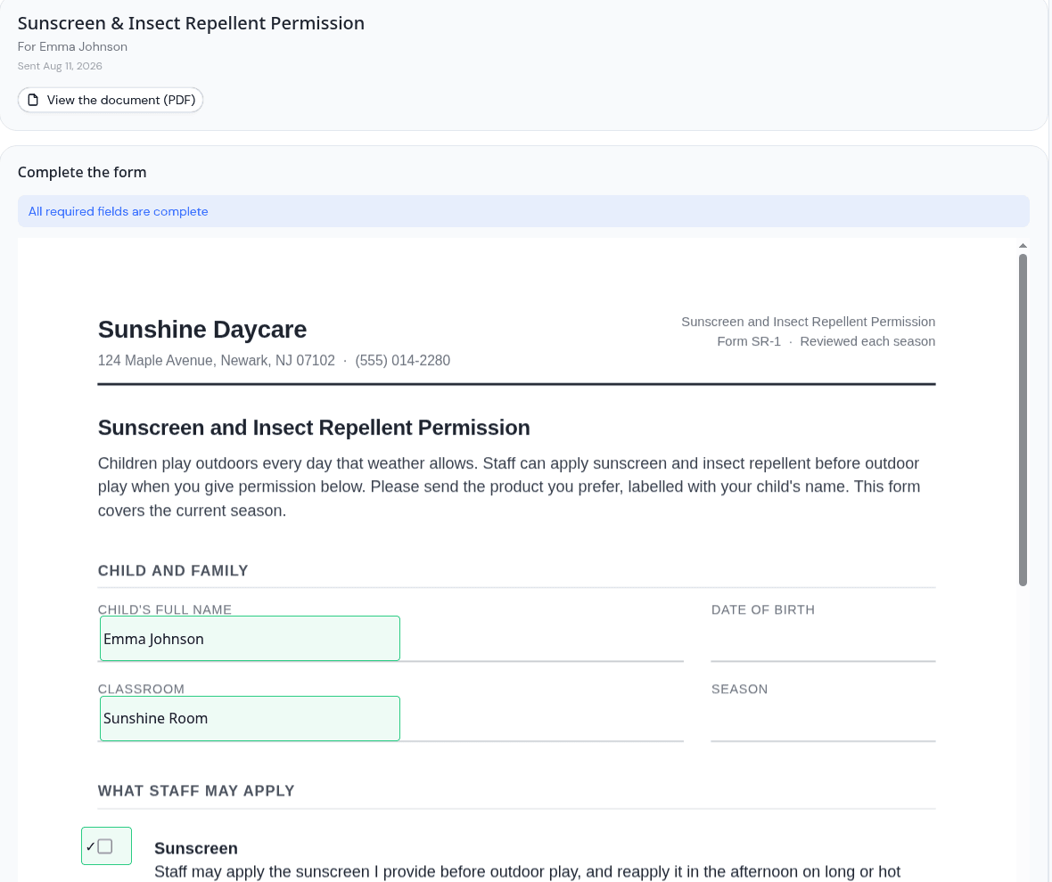 A parent completing a permission form in KidzLog, with the child name, classroom and product fields filled in directly on the document